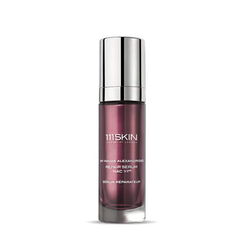 111SKIN Serum in a purple glass bottle